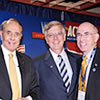 Former Senator Bob Dole (left) and Bill Petasnick, chairman, American Hospital Association, (right) congratulate Al Stubblefield in receiving the Award of Honor
