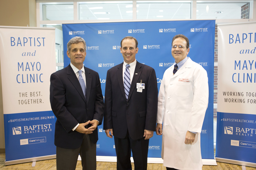 Mark Faulkner CEO-Baptist Health Care, Dr. Stephen Lange, Assistance Professor of Medicine at Mayo Medical School and Dr. James Lonquist - Cardiology posing together at Baptist and Mayo teaming together announcement. .