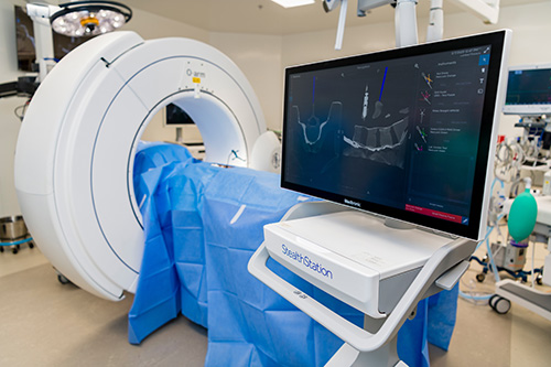 Two doctors performing neurosurgery.