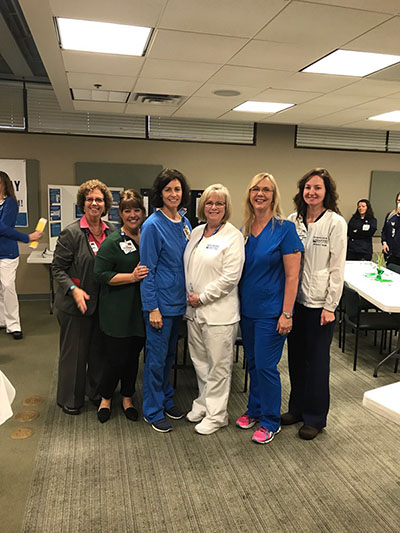 Group of nursing professionals standing together for picture at Certified Nurses Day